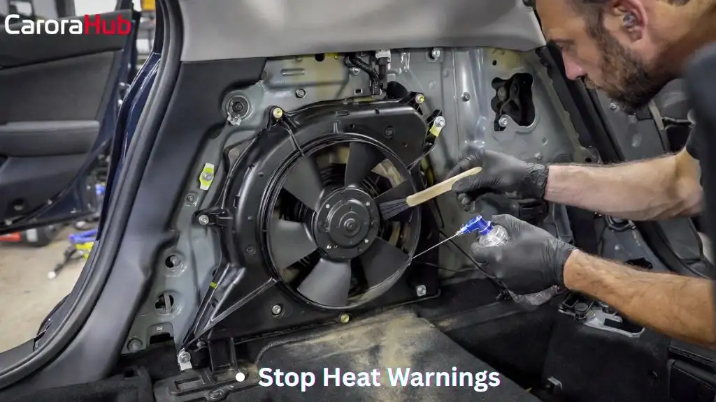 How to Clean the Hybrid Battery Cooling Fan showing Prius rear interior opened and fan being cleaned