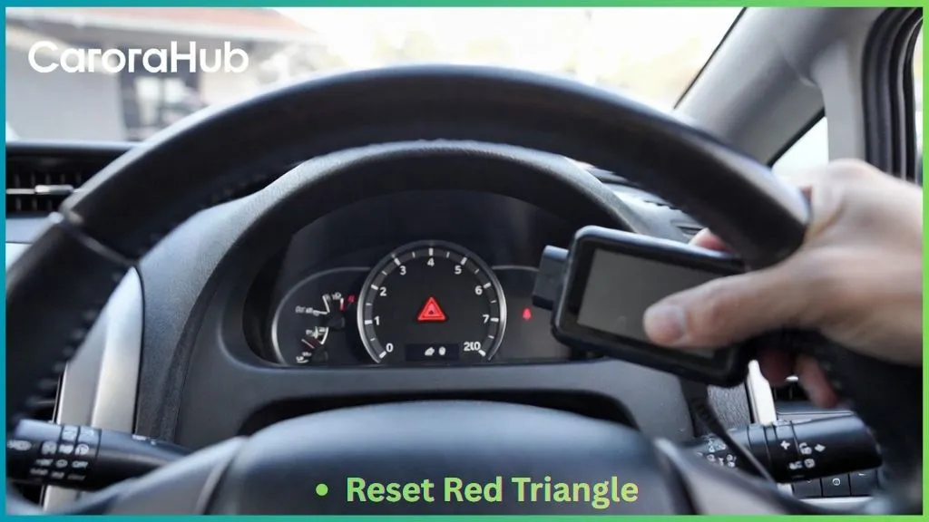 how to reset red triangle toyota prius showing dashboard warning light and OBD2 scanner connected