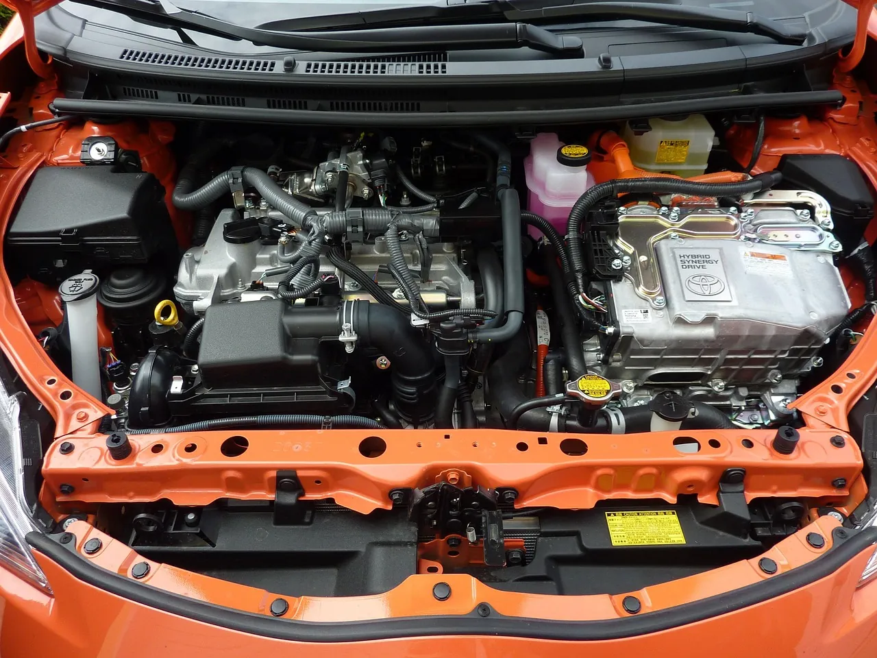 Two distinct car electronic parts being compared for Toyota Prius compatibility in a flat illustration.