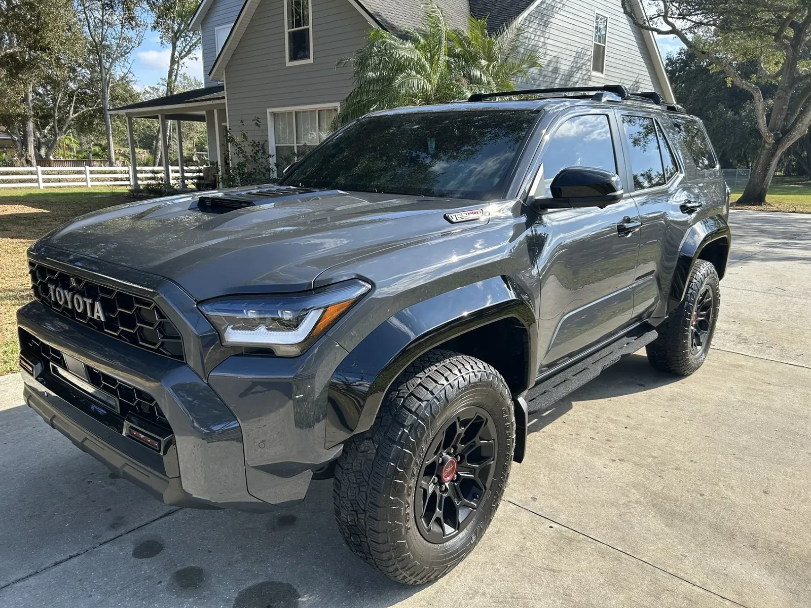 Installation tools for Toyota 4Runner running boards on a garage workbench