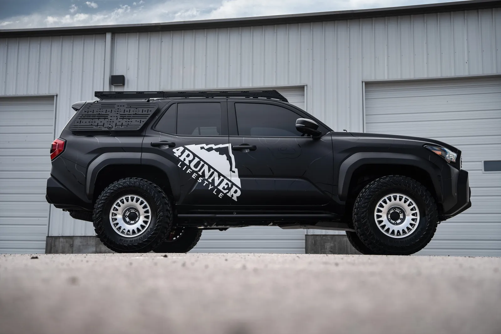 Roof rack types for a Toyota 4Runner displayed on a workbench