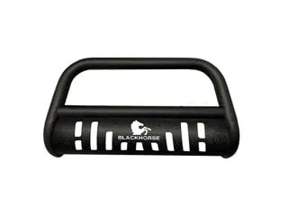 Three different bull bars resting on a concrete garage floor for comparison.