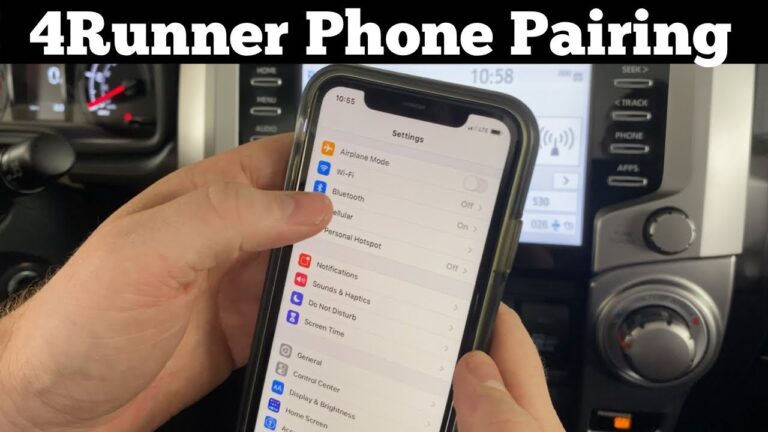 Toyota 4Runner dashboard with a smartphone ready for Bluetooth pairing