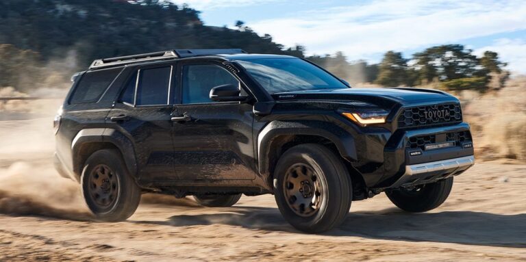 Toyota 4Runner and hybrid SUV compared for fuel economy on a country road