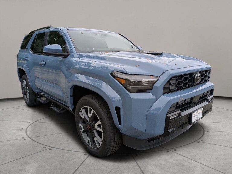 Toyota 4Runner navigation system glowing on a dashboard overlooking mountain forest