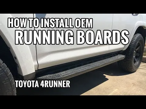 Toyota 4Runner with partially installed running boards in a sunny driveway